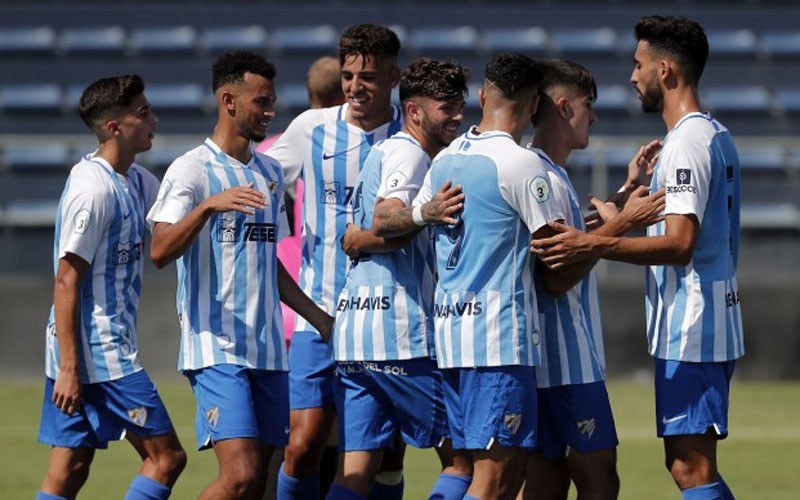 Jugadores del Malagueño celebran un gol